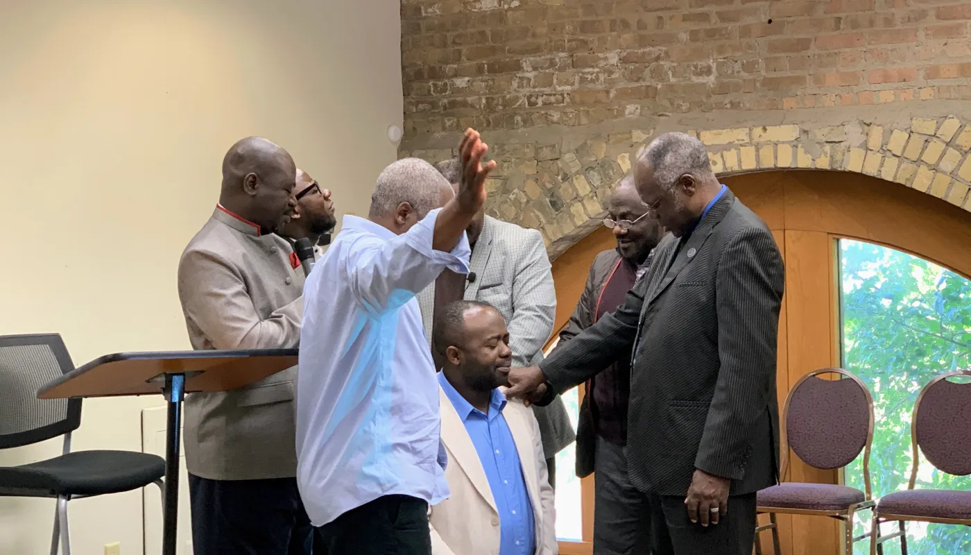 Pastor with church members